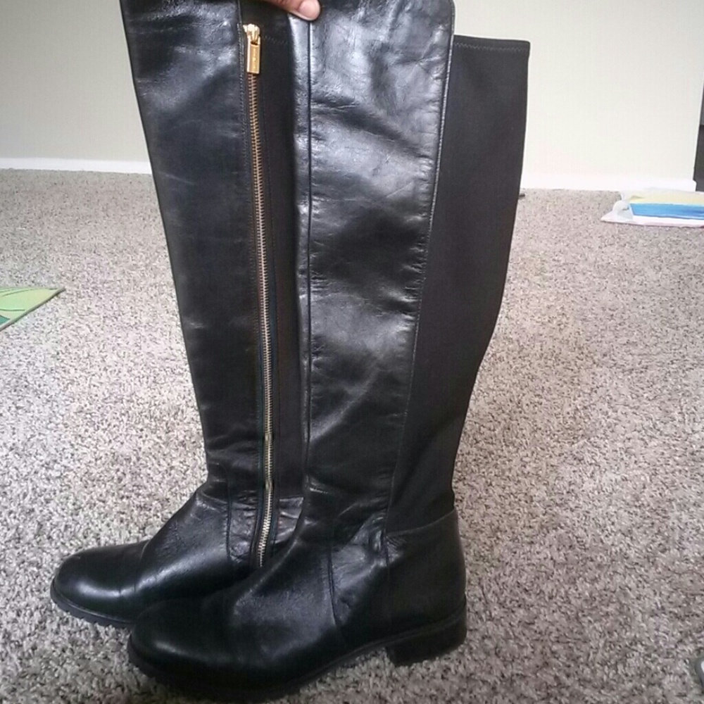 Black knee high Michael Kors boots.